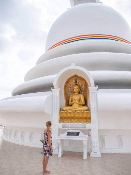 istock Woman visiting temple in Sri Lanka 1328871036