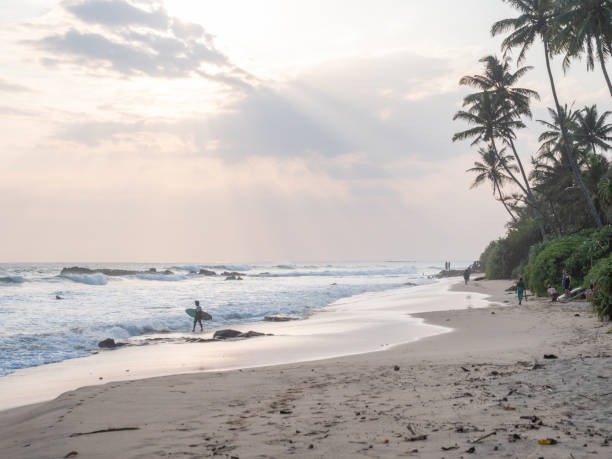 istock Sun setting in an idyllic tropical climate, beach in Sri Lanka 1328871259