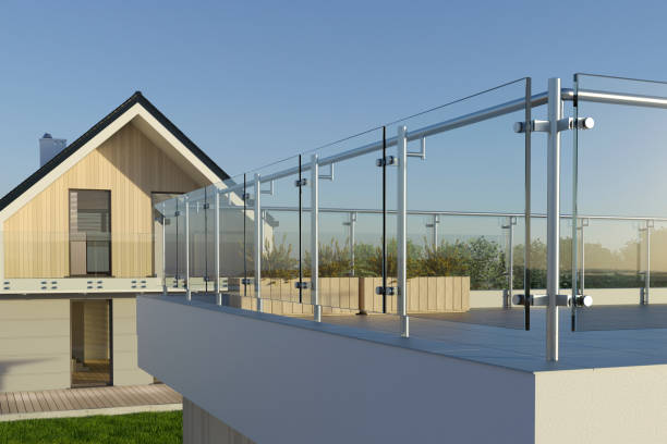 istock Modern stainless steel railing with glass panel and house, 3D illustration 1328872927