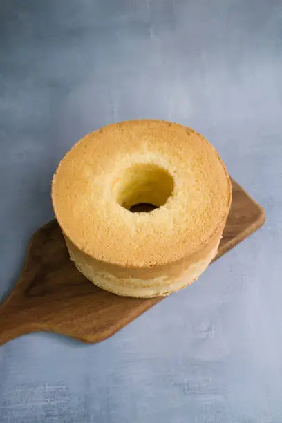 Photo of Chiffon cake on a wood cutting board.