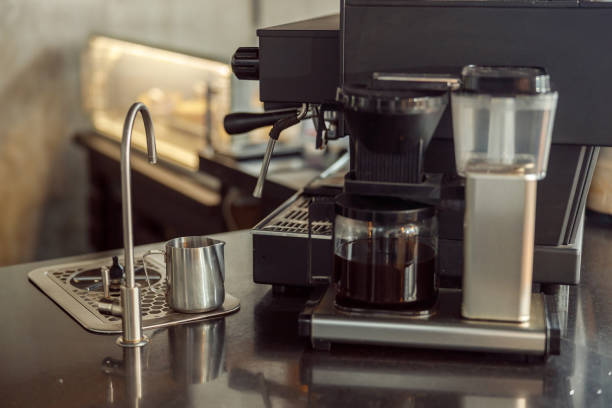 istock coffee making staff in cafe, espresso machine 1328876345