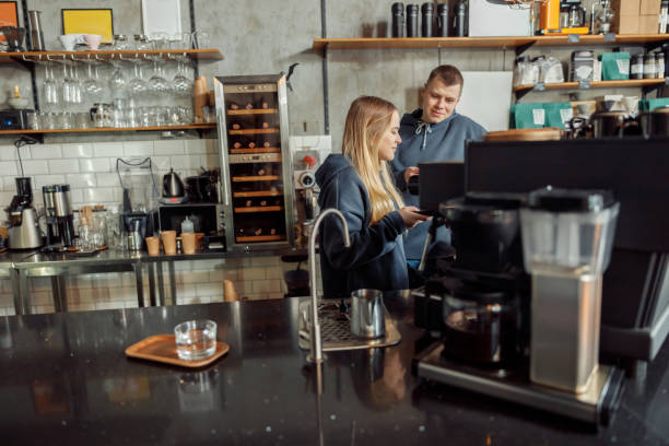 istock Happy smiling professional barista in cafe 1328876354