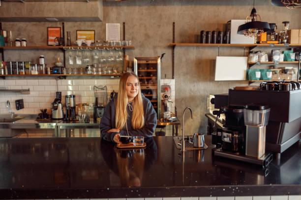 istock Happy smiling professional barista in cafe 1328876356