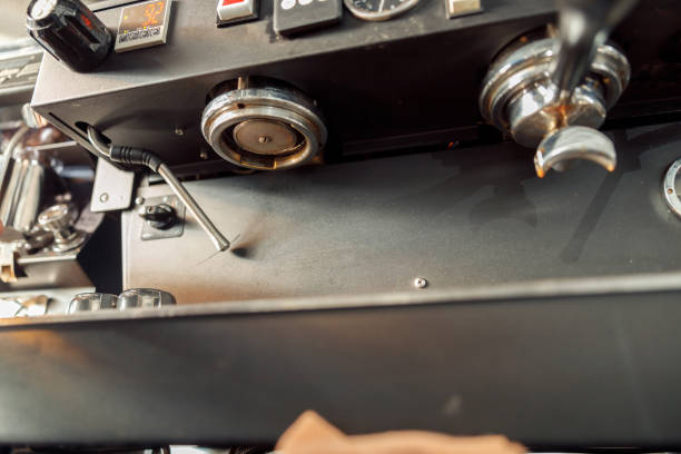 istock coffee making staff in cafe, espresso machine 1328876390