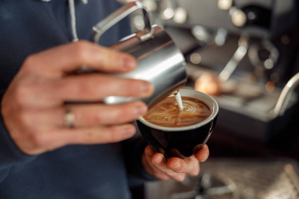 istock Happy smiling professional barista in cafe 1328876395