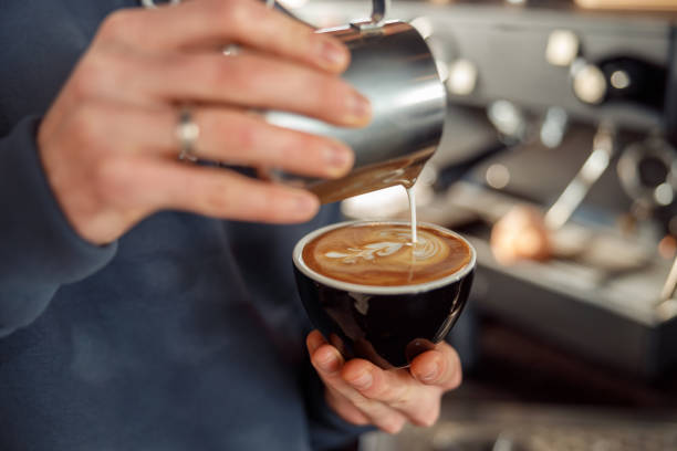 istock Happy smiling professional barista in cafe 1328876398