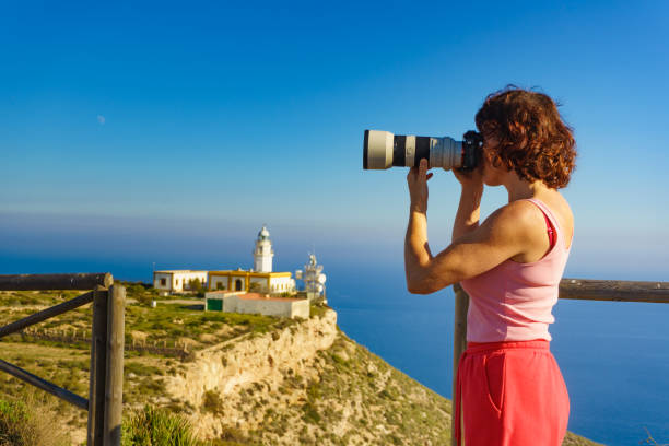 istock Tourist take photo at lighthouse, Cabo de Gata, Spain 1328877776