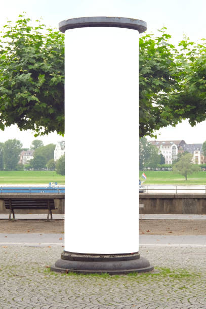 blank advertising pillar,public advertising display, outside setting, free copy space