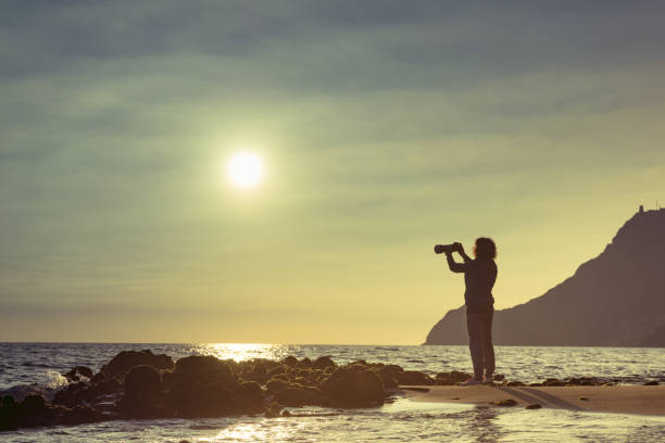 istock Woman with camera on Monsul beach, Spain 1328878051