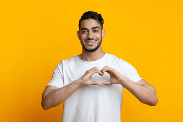 istock Handsome arab guy showing heart with his hands 1328879064