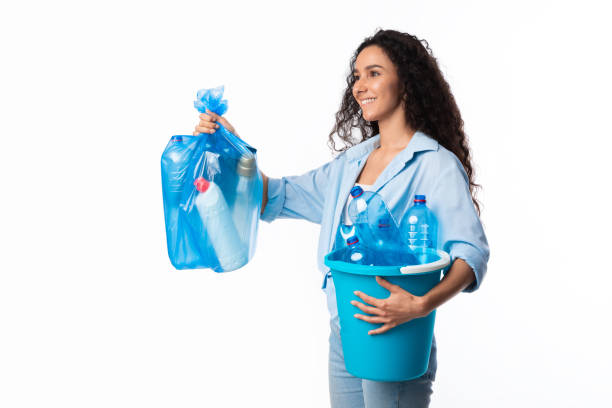 istock Happy Female Giving Bag With Plastic Litter Looking Aside, Studio 1328882944