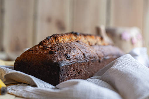 Fresh hand made banana bread on wooden background