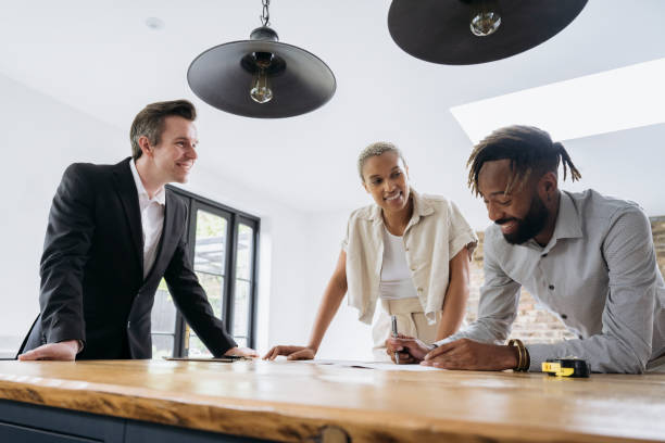 istock Real estate transaction underway with signing of paperwork 1328886213
