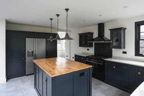istock Stylish domestic kitchen with black accented cabinetry 1328886250
