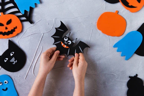 istock How to make decore for Halloween greetings and fun. Children art project. DIY concept. Step by step photo instruction. Finished result 1328888346