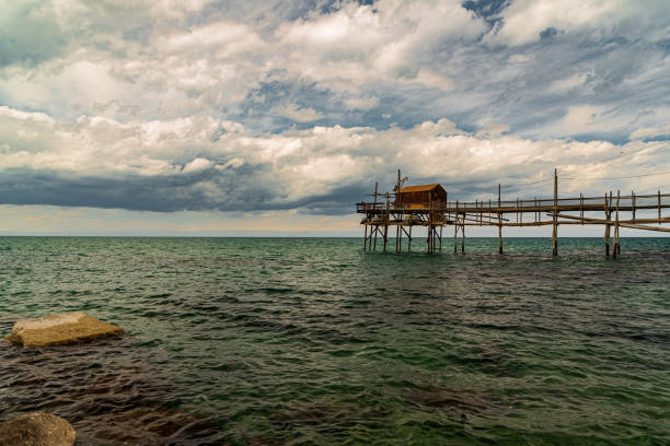 Abruzzo, Italy: reflections of trabocchi on the beach at Pescara. The trabocco is an ancient, wooden fishing machine typical of the Abruzzo coast.
