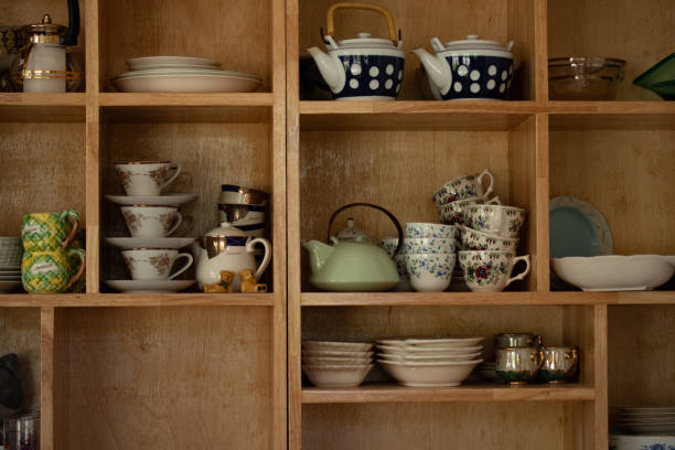 istock Ceramic crockery and bowls arranged in a cabinet for home decoration. 1328890632