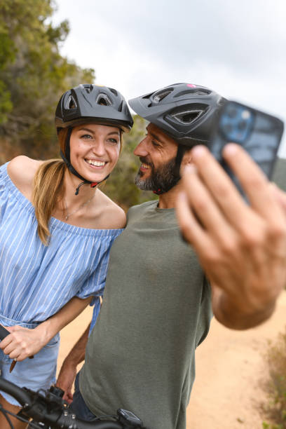 istock Couple using e-bike in Tuscany, Italy 1328890763