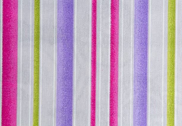 istock White and pink.green and violet striped fabric. Fabric texture,background for design. 1328897044