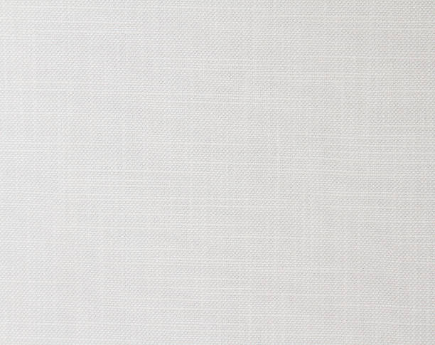 istock White fabric background with a small round rib. Cotton fabric with a simple pattern 1328897052