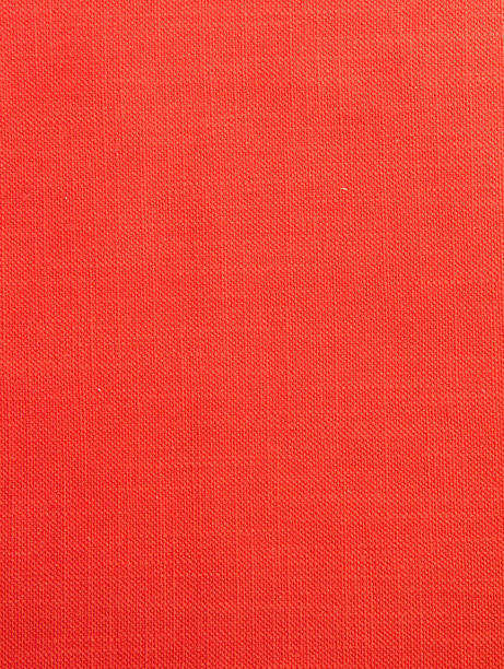 istock Red fabric background with a small round rib. Cotton fabric with a simple pattern 1328897362