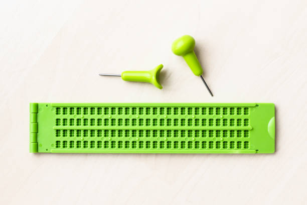 top view of braille writing slate and stylus