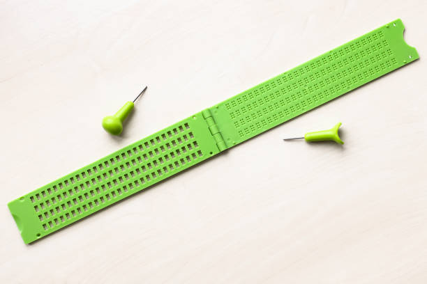 istock open plastic braille writing slate and stylus 1328898216