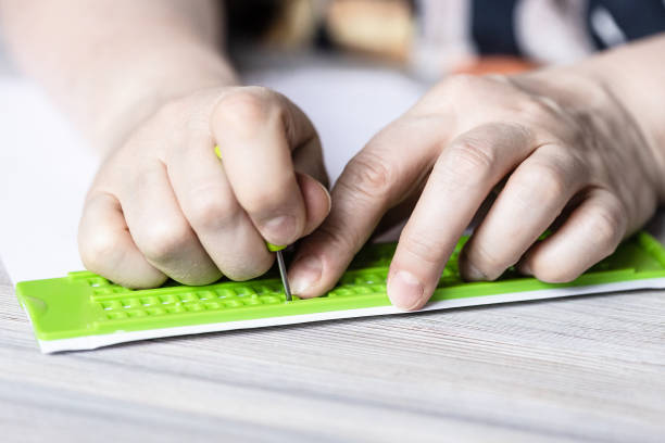 istock front view of printing in braille with slate 1328898223