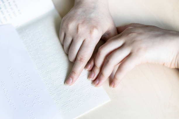 istock top view of reading book and note with braille 1328898232