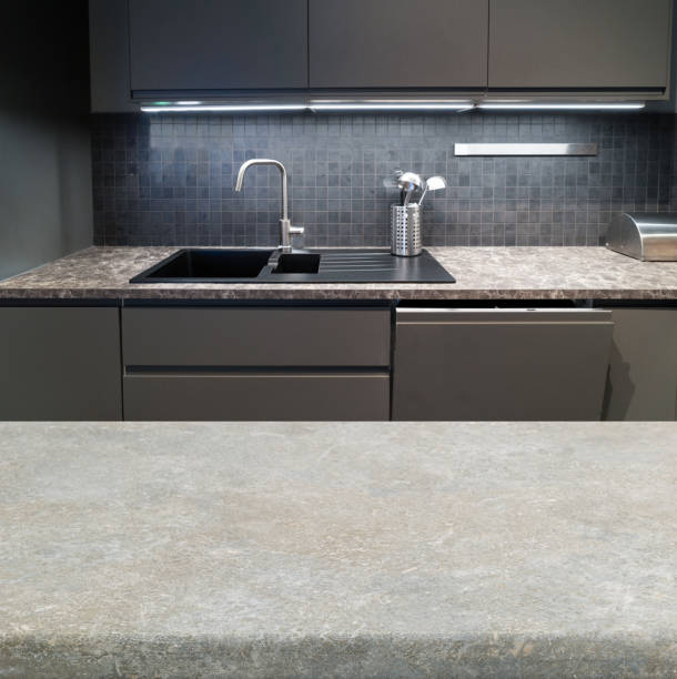 istock Wood table top on blur kitchen room 1328900298