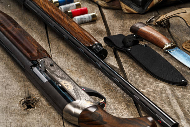 istock Various hunting equipment on old wooden background 1328902736