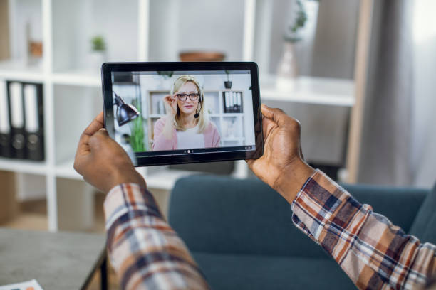 istock Student having video call with teacher on tablet 1328905744