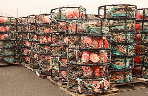 Crab pots sitting on the dock waiting to be taken out to sea