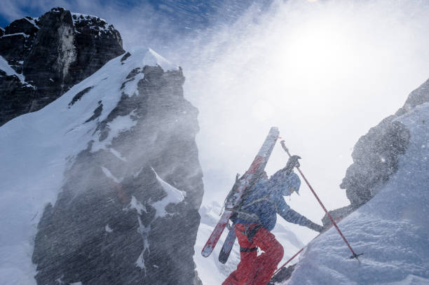 istock Backcountry skier climbs snowy mountain slope 1328911417