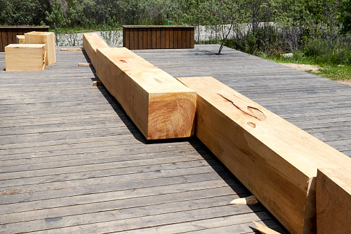 bench bars made of a single trunk of the Tien Shan spruce. Square wooden log