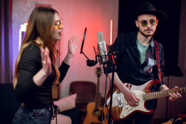 istock Inspired artists creating new song at recording studio 1328918032