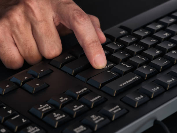 istock A person pressing the enter key on a black keyboard 1328921602