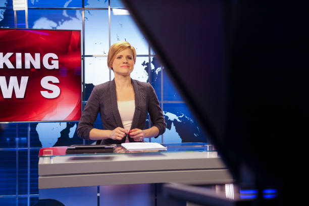 istock Breaking news female anchor 1328922204