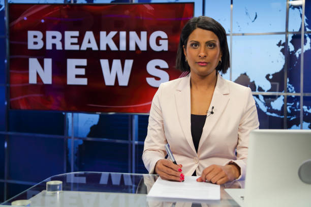 istock Breaking news female anchor 1328922225