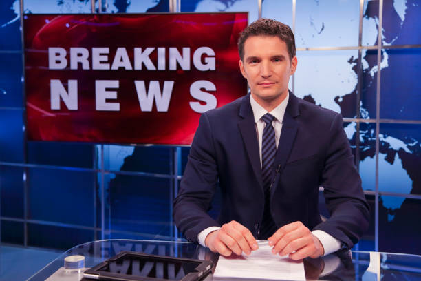 istock Breaking news male anchor 1328922253