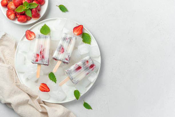 istock Ice cream with strawberries and chia seeds on a light background 1328929729
