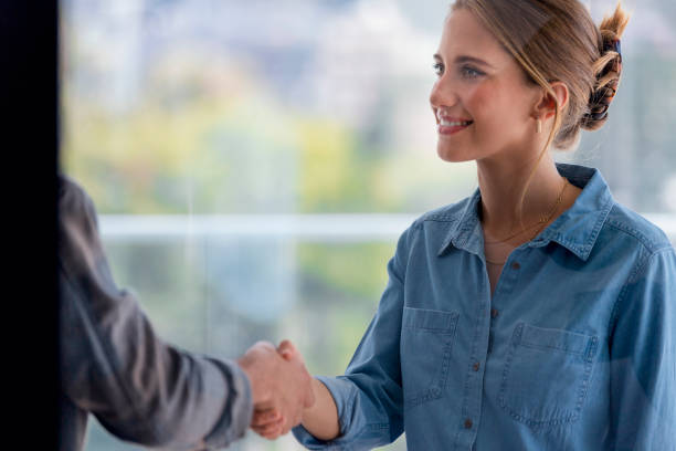 istock Man and woman shaking hands. 1328932679