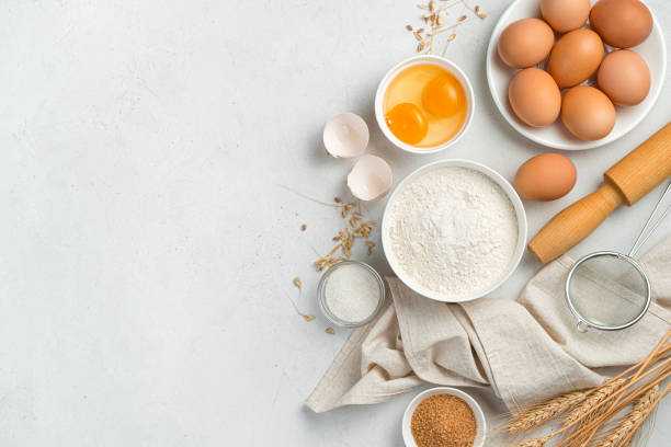 istock Ingredients for making dough dishes: cakes, cookies, pizza, pasta on a gray background 1328936290