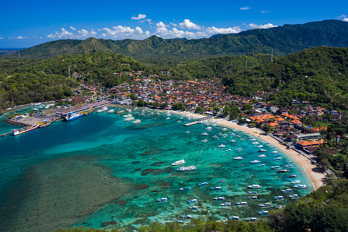 Landscape scenery taken by drone of the peaceful harbour of Padangbai located in Karangasem in Bali.