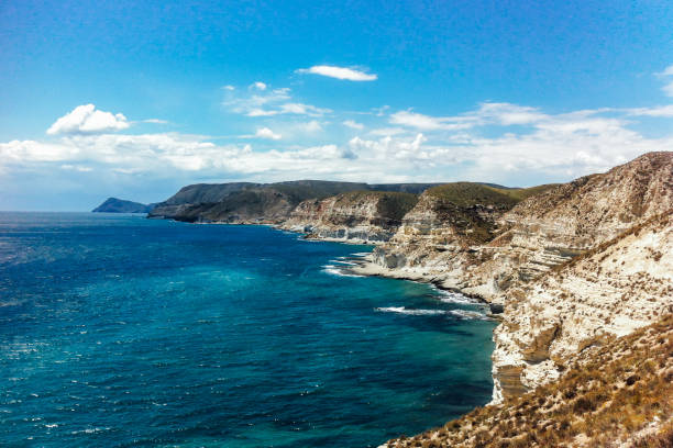 A beautiful view of a seashore under the cloudy blue sky. Nature concept