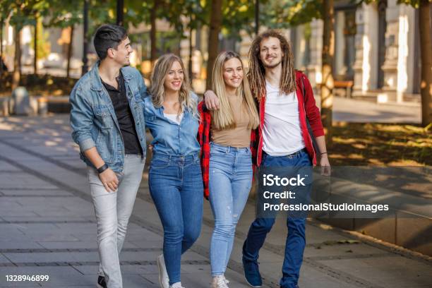 Four young teen girls walking to school, front view close up Stock Photo -  Alamy