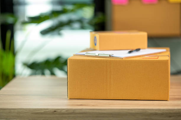 istock cardboard parcel box for online selling,Start up small business entrepreneur working online marketing packaging box delivery 1328947553