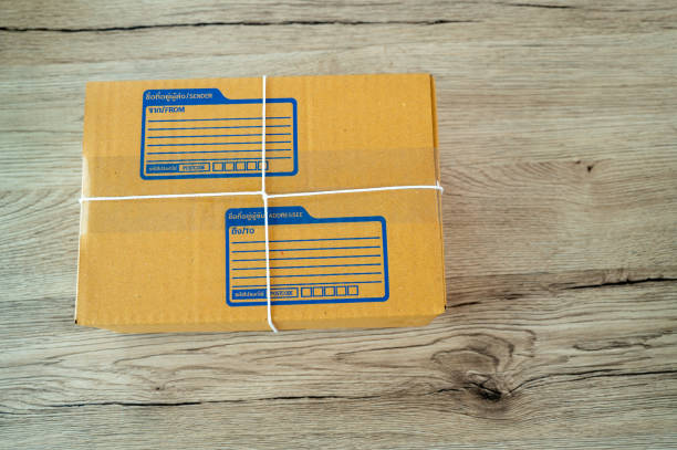 istock cardboard parcel box for online selling,Start up small business entrepreneur working online marketing packaging box delivery 1328947577