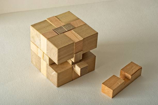テクスチャ紙面上の三次元木製パズルブロック - cube puzzle three dimensional shape block ストックフォトと画像