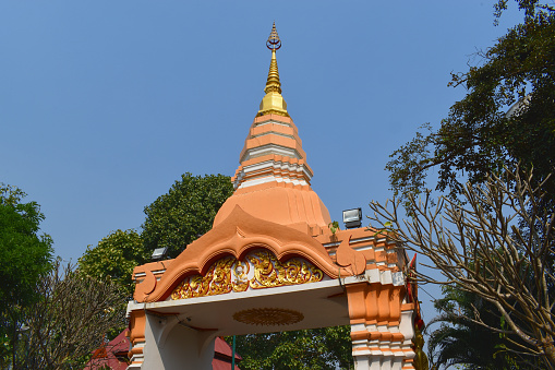 Wat Phra Luang That Nerng, Gate, Sung Men District, Northwest Thailand, like a Chedi, polygonal, higher octagonal, gilded crown on top, Relief with Buddha and Snakes, gilded and outlined in red, mostly orange-brown colored, wonderful Gate, looks beautiful, Artwork, Crafts, Attraction, Point of Interest